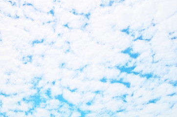 Abstract natural background of white small rounded fluffy clouds cover lot of blue sky in sunny day look like tie dye pattern silk ,has common name is mackerel sky (Cirrocumulus cloud ,altocumulus)