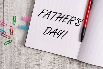 Conceptual hand writing showing Father S Day. Concept meaning day of year where fathers are particularly honoured by children Notebook stationary placed above classic wooden backdrop