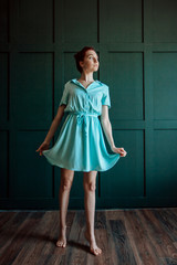 Sexy redhead girl in short dress