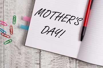 Conceptual hand writing showing Mother S Day. Concept meaning day of year where mothers are particularly honoured by children Notebook stationary placed above classic wooden backdrop