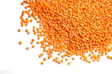 Heap of red lentils isolated on white