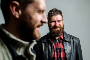 Obraz premium Man bearded guy stand behind back of friend hipster. True friend always near. Stand beside you. Friendship trust and support. Trustful relations. Someone behind you. Feel support of real friend