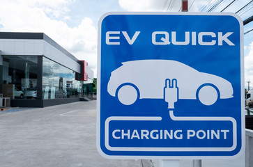 charging station for electric vehicle.outdoor car parking . blue sign EV quick charging point . - 272408633