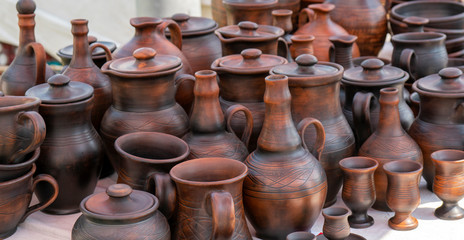 Fototapeta na wymiar Handmade ceramic clay products. Jugs and glasses.