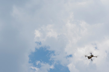 Quadcopter Mavic flies in the sky.
