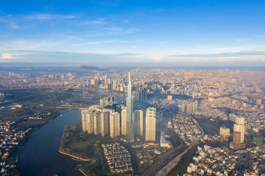 Top View of Building in a City - Aerial view Skyscrapers flying by drone of Ho Chi Mi City with development buildings, transportation, energy power infrastructure. include Landmark 81 building 