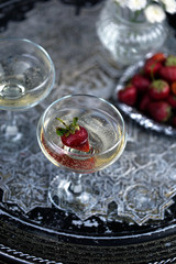 Two glasses of champagne with strawberries