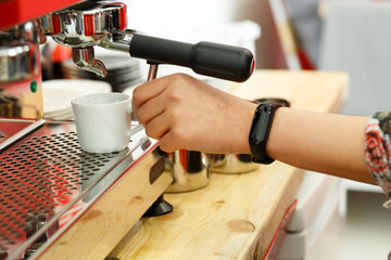 Fototapeta na wymiar Making coffee in a cafe in the summer. Coffee machine.