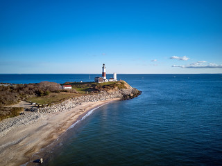 Montauk Lighthouse and beach aerial shot, Long Island, New York, USA.