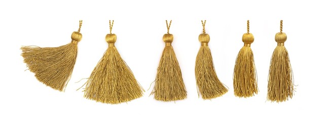 Golden silk tassels isolated on white background for creating graphic concepts