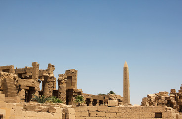 Fototapeta premium Ruins and obelisk in the complex of the Karnak temple, ancient architecture of Egypt in Luxor