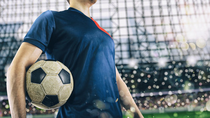 Soccer player ready to play with soccerball at the stadium