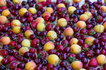 Still life, composition of fruits and berries. Juicy, ripe fruits and berries, apricots, strawberries, cherries, cherries. Berries for the desktop.