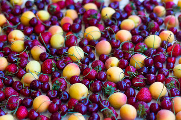 Still life, composition of fruits and berries. Juicy, ripe fruits and berries, apricots, strawberries, cherries, cherries. Berries for the desktop.