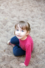 white child girl face closeup portrait on outdoor playground background