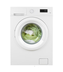 Green clothes in washing machine on isolated white background
