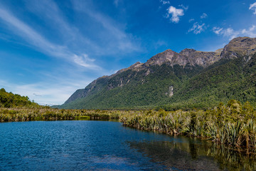Fototapeta na wymiar Huge mountains and lake in Fjordland National park in New Zealand
