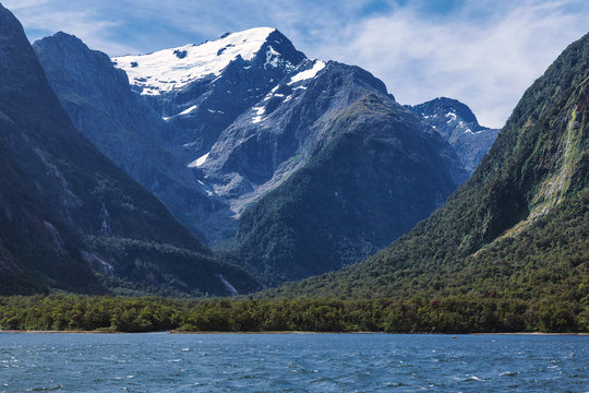 Huge snowy mountains view from Milford Sound in New Zealand South Island