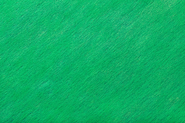 Dark turquoise matt suede fabric closeup. Velvet texture of felt.