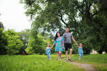 Obraz premium Mom with two daughters twins