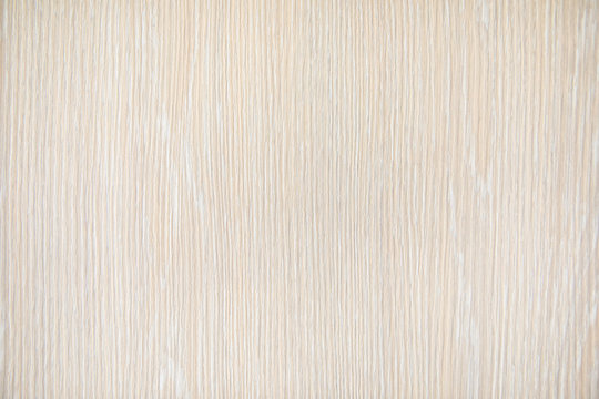 Natural beige wood texture background. Wavy textured plywood, a lot of fiber and small chips, close-up abstract tree background for design, decor and skins
