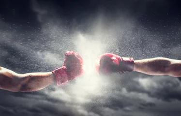 Foto op Plexiglas Twee bokshandschoenen punch. Boksen en vechten © Photocreo Bednarek