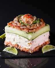 Piece of traditional savory swedish sandwich cake Smorgastorta