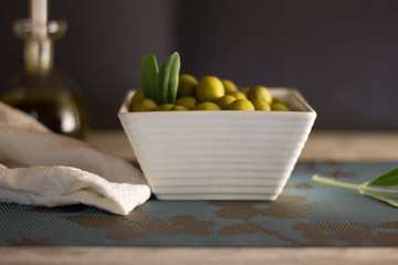olives in bowl on wood