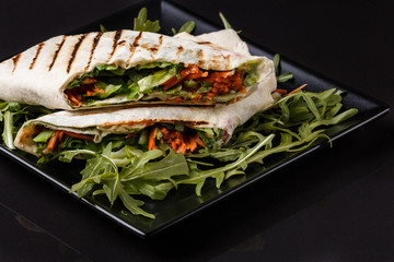 Vegetarian delicious pita with arugula and carrots