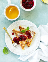 French toast with cherry sauce.