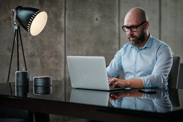 Middle-aged designer working in office