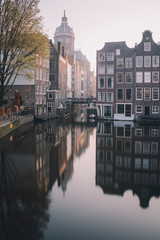Fototapeta premium St Nicolaaskerk with canal houses in Amsterdam in the Netherlands 