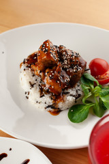 Close up of a vegetarian beetroot salad with greens, almond and goat cream cheese for a healthy dinner