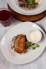 Crunchy chicken cutlet with steamed rice as a part of healthy lunch