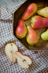 fresh pears with leaves in a bowl