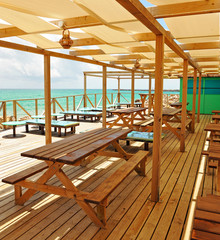 Terrace bar on the beach of Farol Island, Culatra. Natural Park of Ria Formosa, Algarve Region, southern Portugal