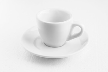 white coffee cup and saucer, empty coffee-free coffee cup, front view from above, or black coffee, on a white background