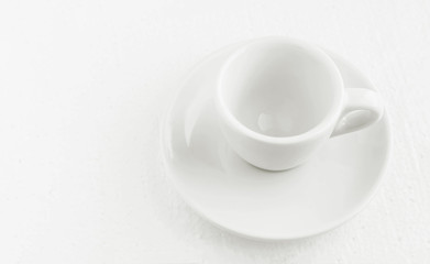 closeup top view on white coffee cup and saucer, empty coffee-free coffee cup, for black coffee, on a white background
