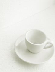 white coffee cup and saucer, empty coffee-free coffee cup, top side view, or black coffee, on a white background