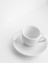 Fototapeta na wymiar white coffee cup and saucer, empty coffee-free coffee cup, top side view, or black coffee, on a white background
