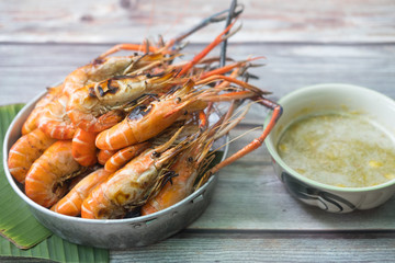 Large grilled shrimps served with seafood sauces
