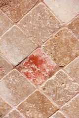 texture of decorative brown ceramic tile with rhombus patterns, cracks and divorces