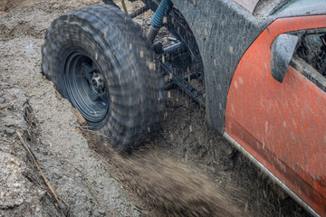 Off-road wheels are spinning, Motion the wheels tires and off-road that goes in the sand.
