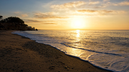 Fototapeta na wymiar Sunrise on the beach. Miami Platja, Costa Dorada Coast, Tarragona, Spain