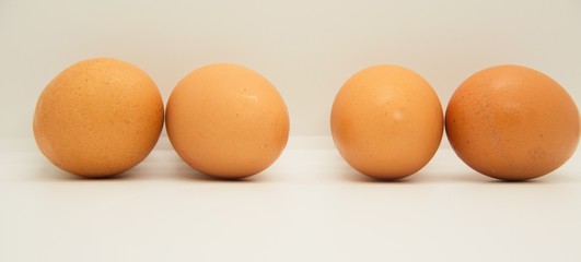 A group of eggs in a white background
