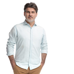 Fototapeta premium Casual confident man holding both hands in his pockets