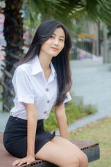 Portrait of thai adult student university uniform beautiful girl relax and smile
