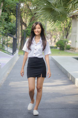 Obraz premium Portrait of thai adult student university uniform beautiful girl relax and smile