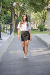 Obraz premium Portrait of thai adult student university uniform beautiful girl relax and smile