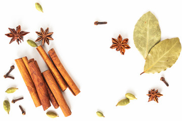 Healthy food concept Mix of organic spices star anise, cinnamon, bay and cardamom pods on white...